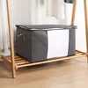 A storage bag sits on a wooden shelf. Produktbild-Vorschau