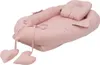 A pink baby nest with a pillow, shown from a diagonal angle on a white background. Produktbild-Vorschau