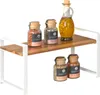 A kitchen shelf with spice jars and a bottle of oil. Anteprima dell’immagine prodotto
