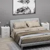 A bedroom scene with a bed, nightstand, and artwork. Anteprima dell’immagine prodotto