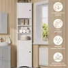 A tall, white bathroom cabinet with open shelves and a closed cabinet at the bottom, placed next to a window. Informational icons are overlaid on the right side of the image. Náhled obrázku produktu