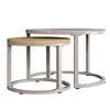 Two nesting coffee tables with round tops and metal frames, shown against a white background. Produktbild-Vorschau