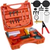 A vacuum pump kit with various accessories laid out in an orange case. Náhľad obrázku produktu