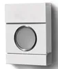 A white mailbox with a circular window is mounted on a wall. Podgląd zdjęcia produktu