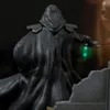A close-up view of a Star Wars statue, showing the back of a hooded figure holding a red lightsaber. Voir les images du produit