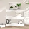 A white bookshelf with books and decorative items on it, set against a plain wall with shadows cast by sunlight. Náhled obrázku produktu