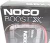 Close-up of the packaging for a Noco Boost X GBX155 jump starter. Voir les images du produit