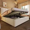 A bedroom scene with a bed that has its storage compartment open, revealing stored items. The bed is made up with bedding and pillows. Anteprima dell’immagine prodotto