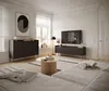 A modern living room with a TV stand, coffee table, and sofa. Produktbild-Vorschau