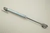 A silver gas strut for furniture is shown on a light gray background. Náhľad obrázku produktu