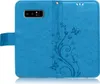 A blue flip case for a smartphone, decorated with a floral and butterfly pattern. Produktbild-Vorschau