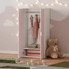 A child's bedroom with a wardrobe, teddy bear, and decorative lights. Produktbild-Vorschau