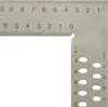 A close-up view of a metal ruler with measurement markings and holes. Produktbild-Vorschau