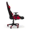 A side view of a gaming chair with a footrest extended. Voir les images du produit