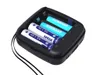 A battery charger with batteries inside, shown from a slightly elevated angle on a white background. Produktbild-Vorschau