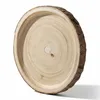 A round wooden tray made from a tree slice, shown from a slightly elevated angle against a white background. Náhľad obrázku produktu