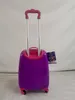 A purple and pink children's suitcase with a retractable handle. Anteprima dell’immagine prodotto