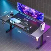 A gaming desk setup with dual monitors, keyboard, mouse, controller, headphones, and a console. Voir les images du produit