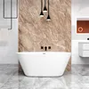 A modern bathroom with a freestanding bathtub against a marble-patterned wall. Produktbild-Vorschau