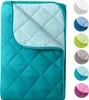 A folded quilted blanket shown from above, with a collage of color swatches on the right. Produktbild-Vorschau