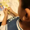 A child is assembling a model of the human skeleton. Anteprima dell’immagine prodotto