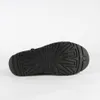 The sole of a black UGG boot is shown against a white background. Náhled obrázku produktu