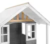 Close-up view of the roof and upper section of a wooden playhouse, showing the roof structure, windows, and wooden walls. Náhled obrázku produktu