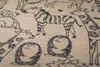 A close-up view of a blanket with a pattern of various animals drawn in black outline. Produktbild-Vorschau