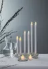 A table setting with LED candles, glasses, and a carafe. Produktbild-Vorschau