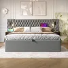 A bedroom scene featuring a large upholstered bed with integrated nightstands and lighting. Náhled obrázku produktu