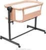 A baby crib on a stand with wheels. Náhled obrázku produktu