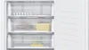 The interior of a white refrigerator or freezer with clear drawers and shelves. Produktbild-Vorschau