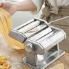 A person is using a pasta maker to make fresh pasta. Produktbild-Vorschau