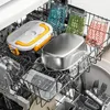 Close-up view of a dishwasher rack filled with various items, including food containers and glasses. Produktbild-Vorschau