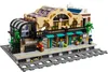 A LEGO model of a train station with people and train tracks. Voir les images du produit