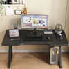 A gaming desk setup with a computer, monitor, laptop, and headphones. Produktbild-Vorschau