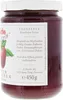 A close-up side view of a jar of strawberry jam. Produktbild-Vorschau