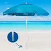 A blue beach umbrella on a sandy beach with the ocean and sky in the background. A close-up inset shows the screw-in base of the umbrella pole. Voir les images du produit