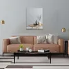 A modern living room with a sofa, coffee table, and a mirror on the wall. Produktbild-Vorschau