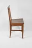 A side view of a wooden chair. Produktbild-Vorschau