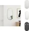 A mirror is shown hanging on a white wall next to a framed picture and a wooden cabinet. Produktbild-Vorschau