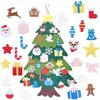 A collection of felt Christmas tree ornaments and a felt Christmas tree base laid out on a white background. Produktbild-Vorschau