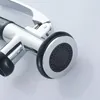 Close-up view of a chrome and black kitchen spray nozzle with a textured spray head. Produktbild-Vorschau