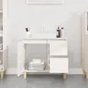 A white bathroom vanity with an open cabinet and drawers, containing folded towels and toiletries. Náhľad obrázku produktu