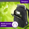 A black Targus backpack with a laptop inside, set against a blurred green leafy background. Náhľad obrázku produktu