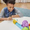 A young girl playing a board game. Produktbild-Vorschau