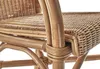 A close-up view of the woven rattan seat and armrest of a chair. Produktbild-Vorschau