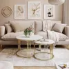 A living room scene featuring a sofa, coffee tables, and artwork. Produktbild-Vorschau