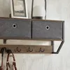 Nahaufnahme der Stoffboxen und Haken der SoBuy Wandgarderobe FHK26-N an der Wand Anteprima dell’immagine prodotto
