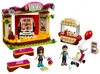 A LEGO Friends set depicting a park stage, a hot dog stand, and figures. Podgląd zdjęcia produktu